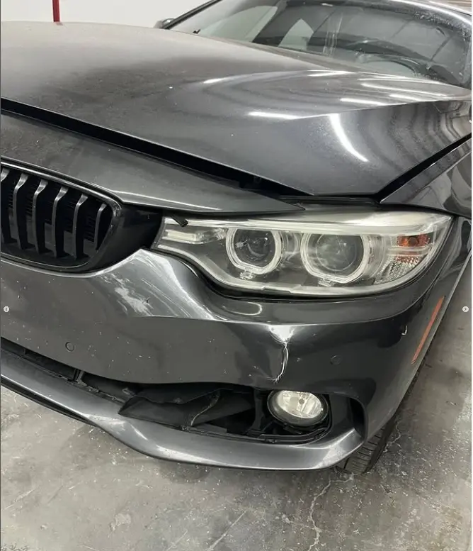 BMW with damaged front bumper before repair at CT Collision in Kissimmee, Florida