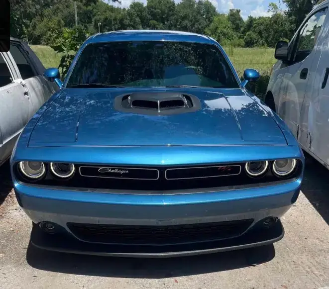Dodge Challenger fully restored after front collision repair with factory-perfect paint match in Kissimmee, Florida