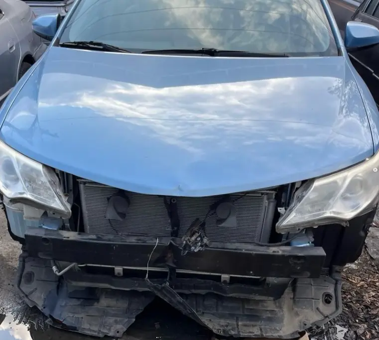 Toyota Camry with front collision damage before repair at CT Collision in Kissimmee, Florida
