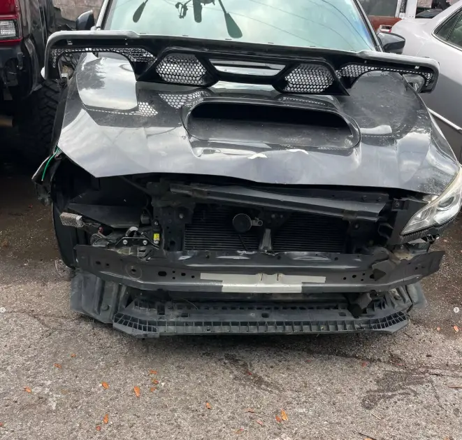 Subaru WRX with collision damage before repair at CT Collision in Kissimmee, Florida