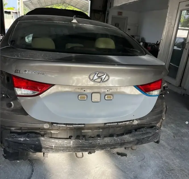 Hyundai Elantra with damaged rear bumper before repair at CT Collision in Kissimmee, Florida