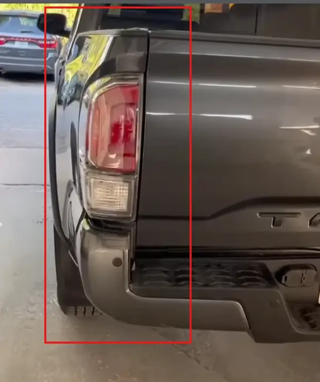 Toyota Tacoma tail light and rear panel dent damage repaired at CT Collision in Kissimmee, Florida